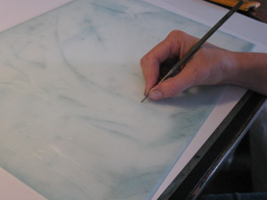 Artist Shana James drawing onto drypoint plate